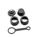 A set of black silicone accessories for a vaporizer, including a tethered cap, two separate caps, and a ring-shaped tool, displayed against a white background.
