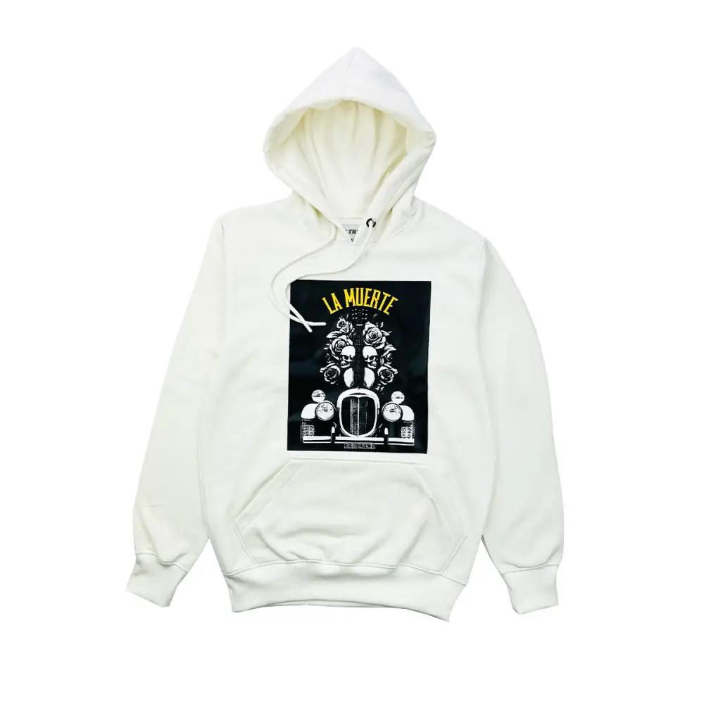 Front view of a white hoodie featuring a large black graphic print with yellow 'LA MUERTE' text, skulls, roses, and the front grille of an old car.