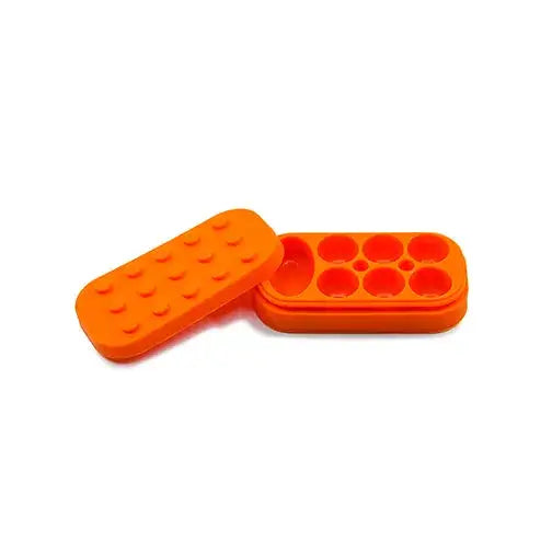 Close-up of an open, rectangular orange silicone container with a lid featuring small, rounded bumps, and a base with multiple circular and one oval compartment, set against a white background.