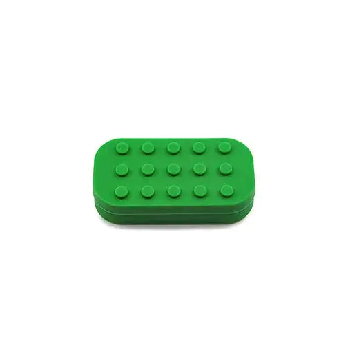 A vibrant green, rectangular silicone container designed in the style of a Lego brick, featuring twelve raised circular studs on its top surface, isolated against a white background.