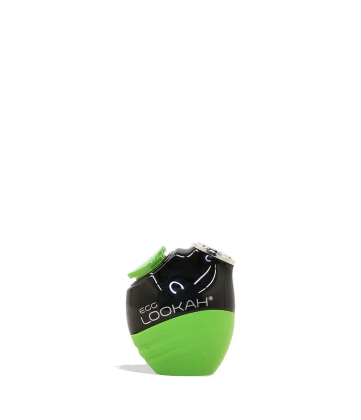 A small, egg-shaped electronic device, black on top and bright lime green on the bottom, with 'EGG LOOKAH' branding visible on the black section. It features a textured green base and a small green button on the top.
