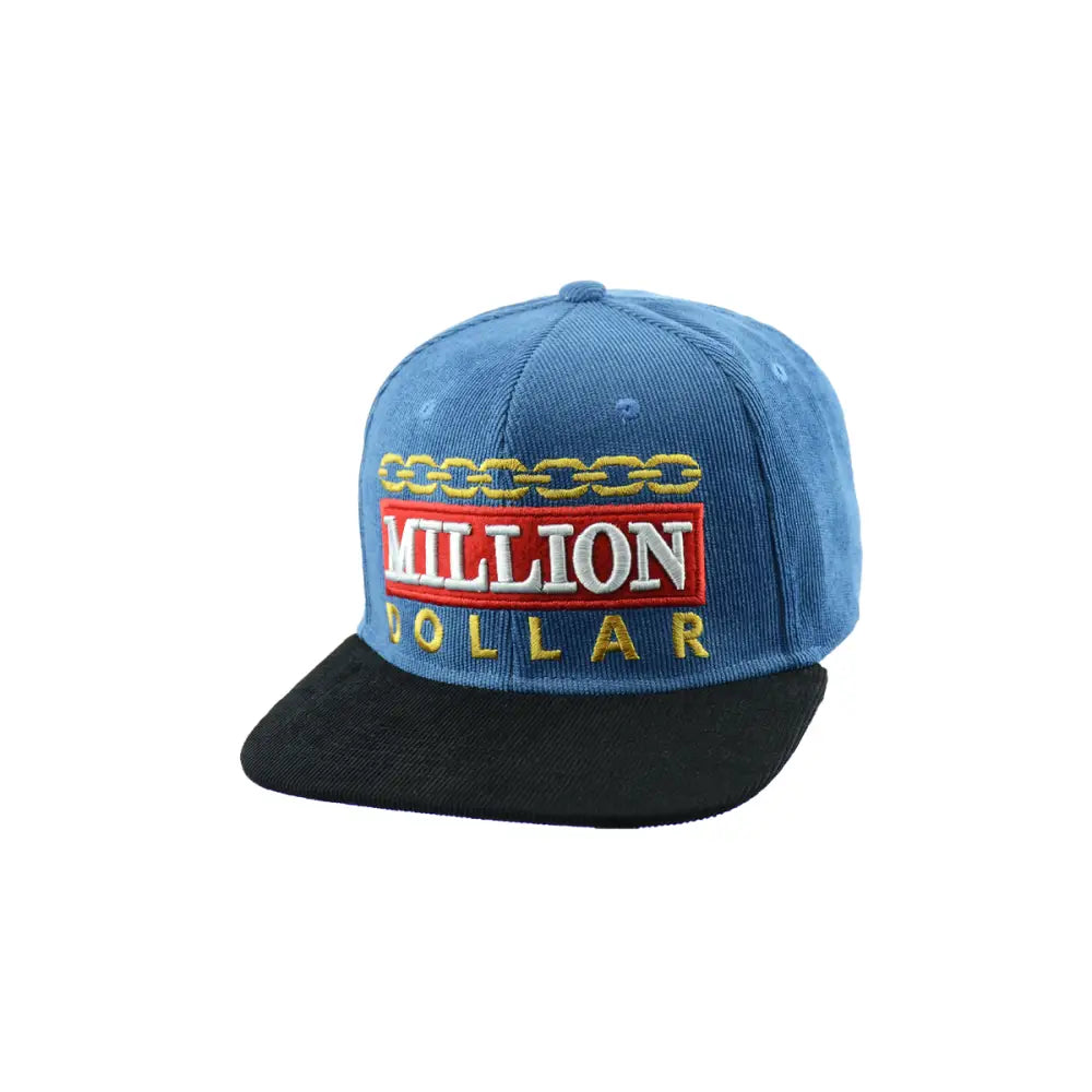 A blue corduroy snapback hat with a black brim, featuring 'MILLION DOLLAR' embroidered in red and gold, with a gold chain design above the text.