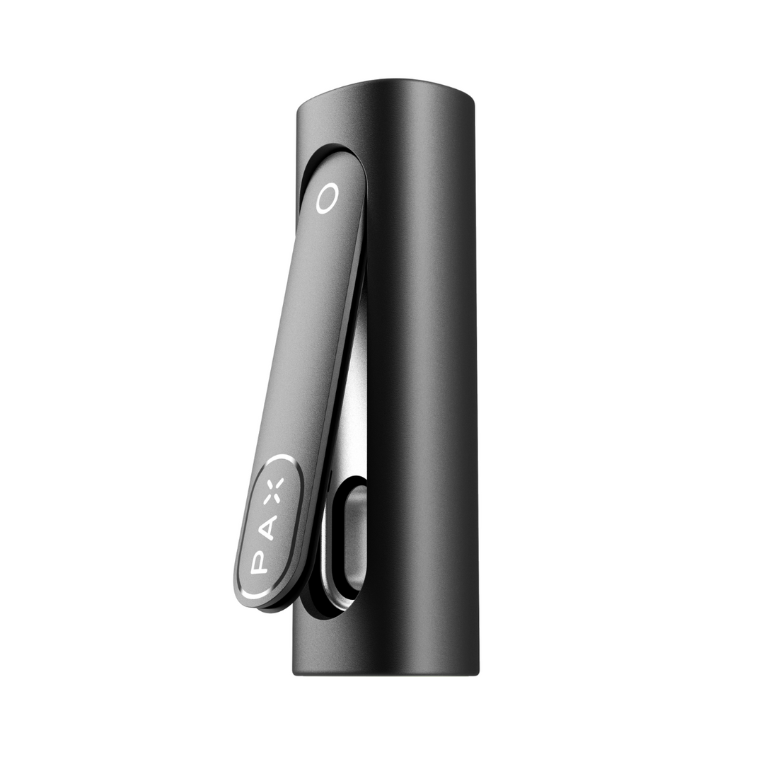 Close-up detail shot of the top portion of a sleek, dark grey cylindrical portable vaporizer, showing its hinged mouthpiece with the 'PAX' logo and a circular indicator.