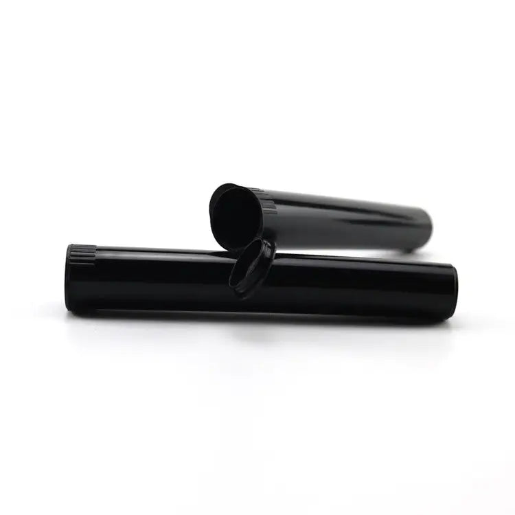 Two black cylindrical plastic tubes, one with its hinged cap open, resting horizontally on a clean white surface.