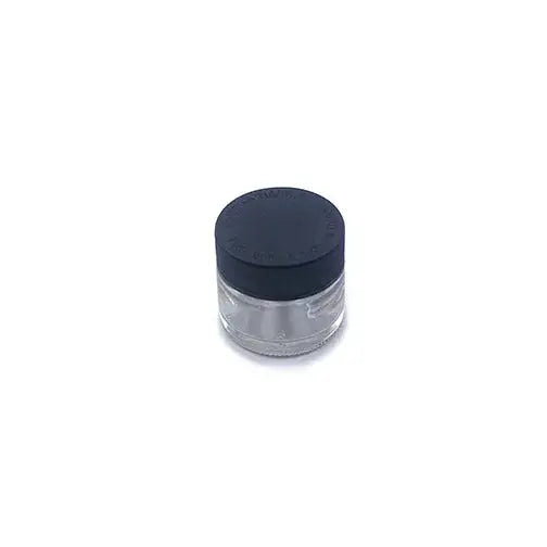 A small, clear glass jar with a black screw-on lid, positioned at a slight angle on a plain white background, showcasing its compact size and simple design.