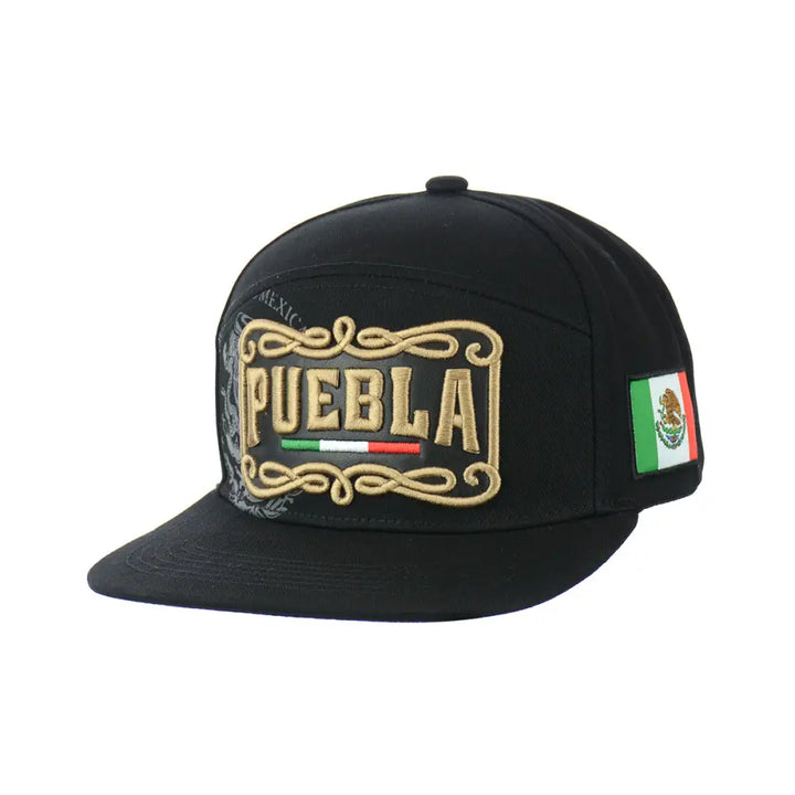 Close-up view of a black snapback hat featuring an embroidered 'PUEBLA' design with Mexican flag colors and a small Mexican flag patch on the side.