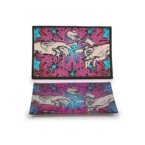 Two rectangular items, a flat mat and a glass tray, stacked on a white background. Both feature a vibrant design of two hands reaching towards a cloud of smoke against a pink and blue mandala pattern.