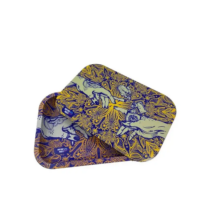 Two rectangular metal rolling trays, one slightly overlapping the other, displaying an intricate blue and yellow pattern of hands reaching towards each other amidst floral and mandala-like designs, set against a white background.