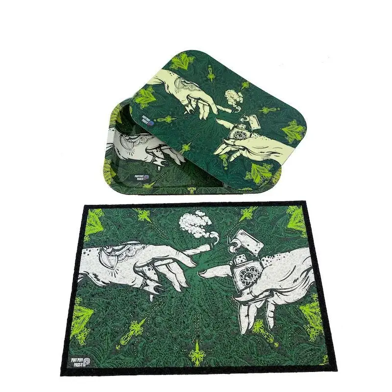 A matching green rolling tray with a lid and a rectangular moodmat, both featuring a 'Creation of Adam' parody design with hands, a joint, and a lighter, displayed on a white background.