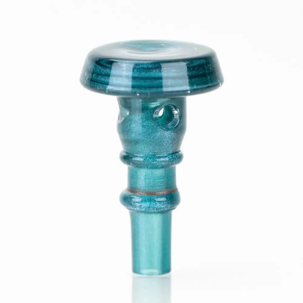 A small, teal blue-green glass accessory with a mushroom-shaped top and a cylindrical stem. It has a shimmery finish and small holes on the side of the stem.