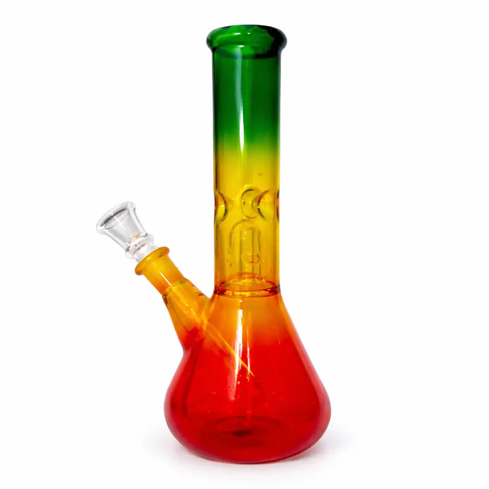 Glass water pipe with a beaker base and straight neck, featuring a red, yellow, and green Rasta color gradient. A clear glass downstem and bowl are attached.