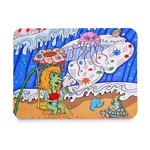 Close-up of a silicone dab mat featuring a vibrant cartoon beach scene with a green-skinned woman smoking, a jellyfish, and a turtle.