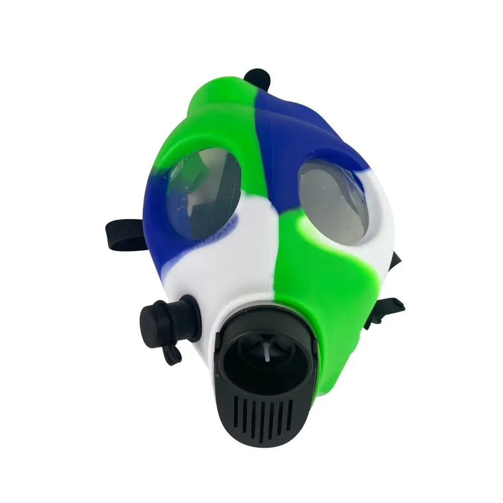 Close-up, angled view of a silicone gas mask bong featuring a vibrant green, blue, and white camouflage pattern.
