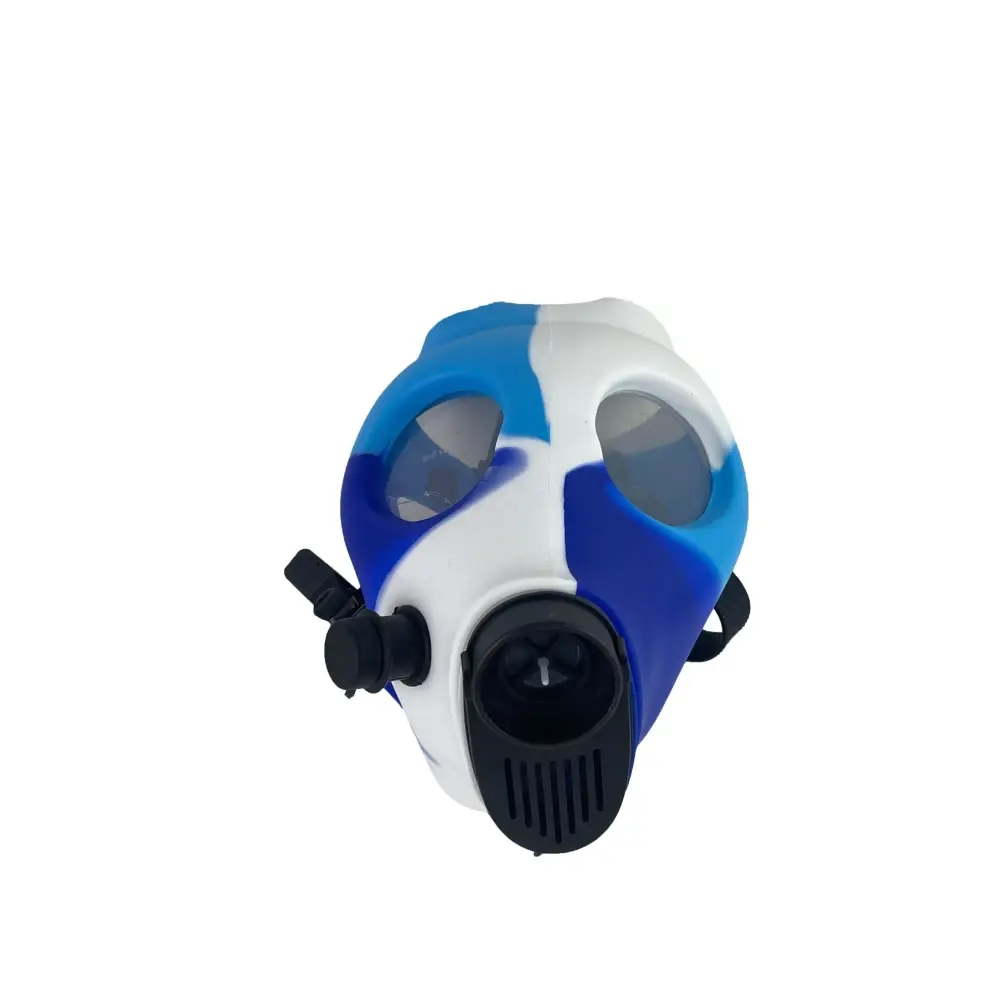 Front-facing, slightly angled view of a silicone gas mask bong featuring a blue and white camouflage pattern, with black straps and a black mouthpiece/filter attachment.
