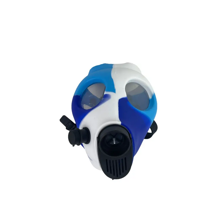 Front-facing, slightly angled view of a silicone gas mask bong featuring a blue and white camouflage pattern, with black straps and a black mouthpiece/filter attachment.