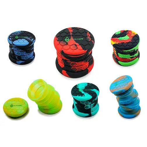 Multiple collapsible silicone jars in various multi-color combinations including blue/black, red/black, green/red/black, yellow/green, teal/black, and blue/orange, displayed against a white background.