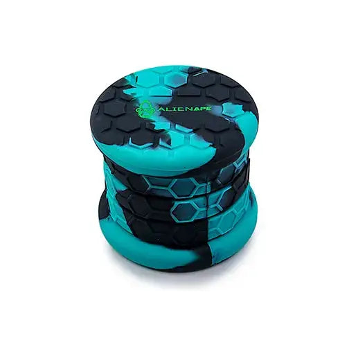 A collapsible silicone jar with a teal and black camouflage pattern, featuring a hexagonal texture and a green 'ALIENAPE' logo on the lid, shown against a white background.