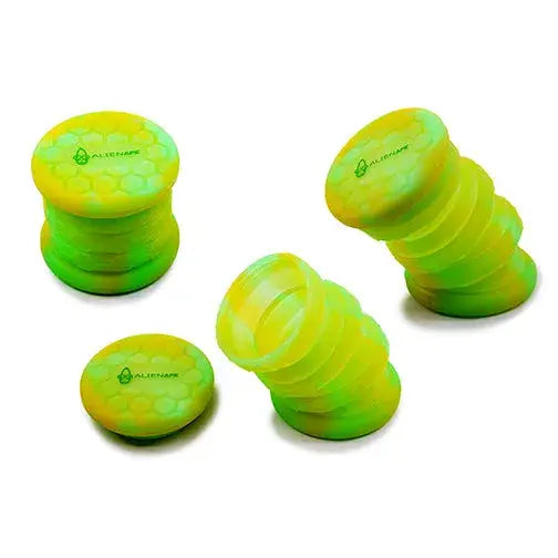 Three collapsible silicone jars in vibrant green and yellow, showcasing their expanded and collapsed forms on a white background.
