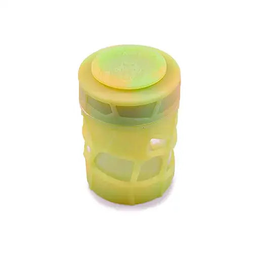 Close-up of a stackable silicone jar with a light yellow-green body and a brighter lime green lid, showing its textured sides.