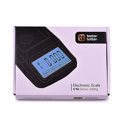 Close-up view of a light purple and black product box for an electronic scale, featuring the 'teeter totter' brand logo and product details.