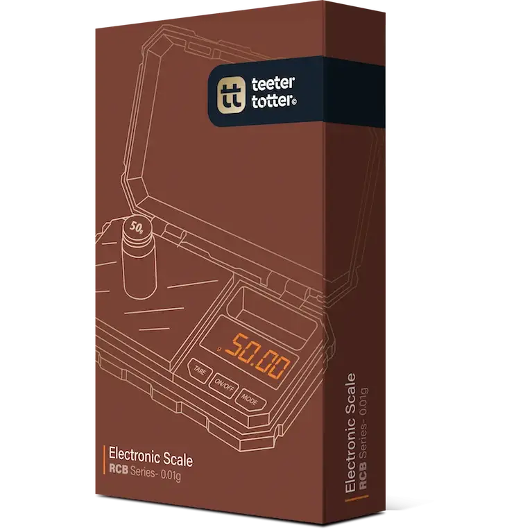 Product packaging for an electronic scale, featuring a brown box with an outline illustration of the scale displaying '50.00' and a 50g calibration weight, with the 'teeter totter' logo at the top.