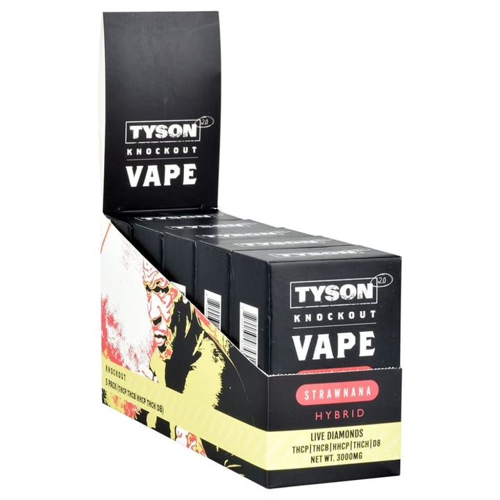 A black display box filled with several black vape pens, featuring 'Tyson Knockout Vape' branding and a graphic of Mike Tyson on the side.