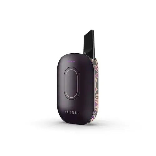 A dark purple, compact vaporizer battery with a rounded, oval shape, featuring an abstract purple and beige pattern on one side, shown at a slight angle on a white background.
