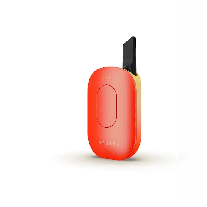 A sleek, compact, oval-shaped vaporizer battery in a vibrant orange-red color with a black mouthpiece protruding from the top, shown against a white background.