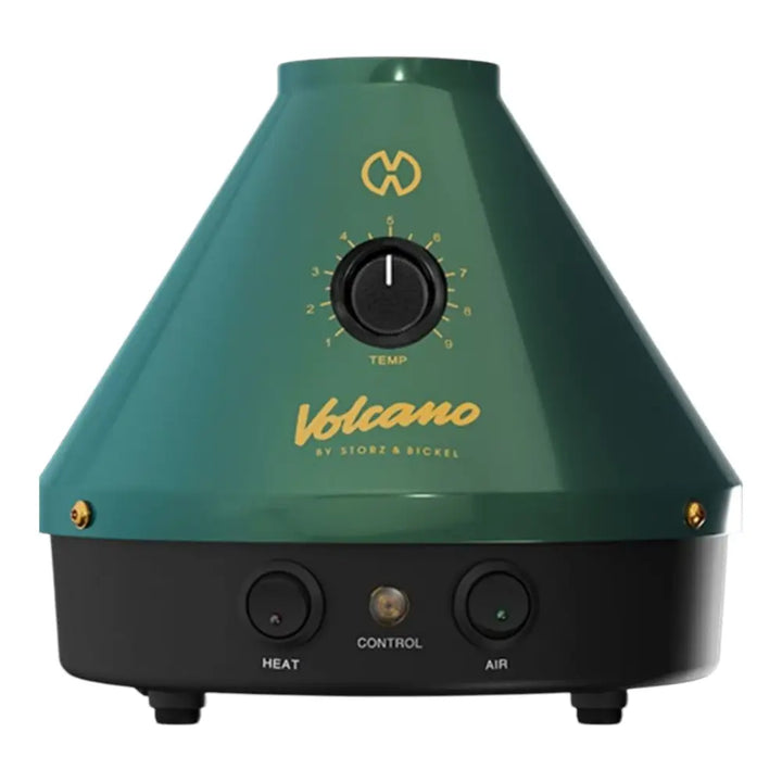 A dark teal, conical desktop vaporizer with a black base, featuring a central temperature dial, 'Volcano' branding, and three control buttons on the front.