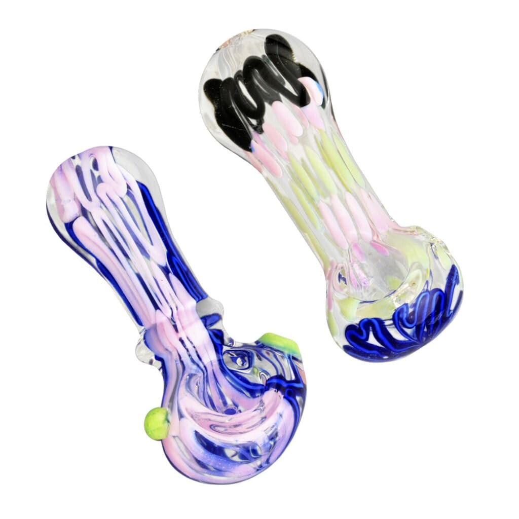Two colorful glass hand pipes with swirled and speckled designs, one predominantly blue and pink, the other yellow and pink with black accents.