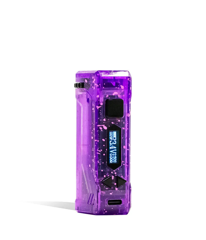 A translucent purple cartridge vape with pink splatter paint design, featuring a digital screen displaying battery life and voltage, shown upright on a white background.