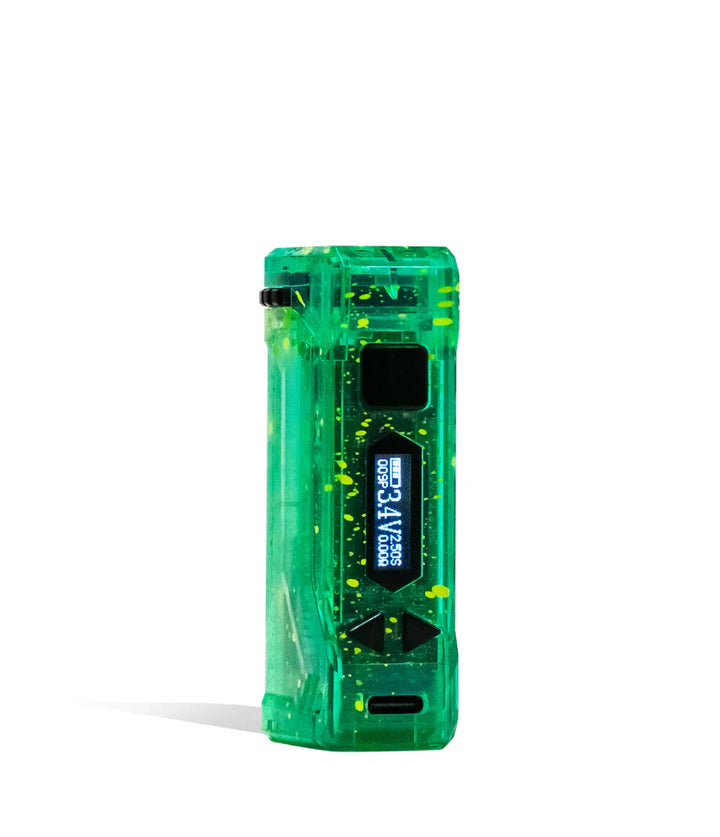 Close-up of a translucent green cartridge vape with yellow speckles, displaying its digital screen showing '3.4V' and control buttons.