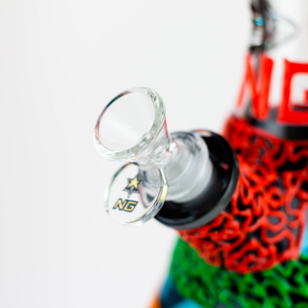 Close-up detail shot of the clear glass joint and bowl of a water pipe, featuring an 'NG' logo with a star on the glass, against a white background.