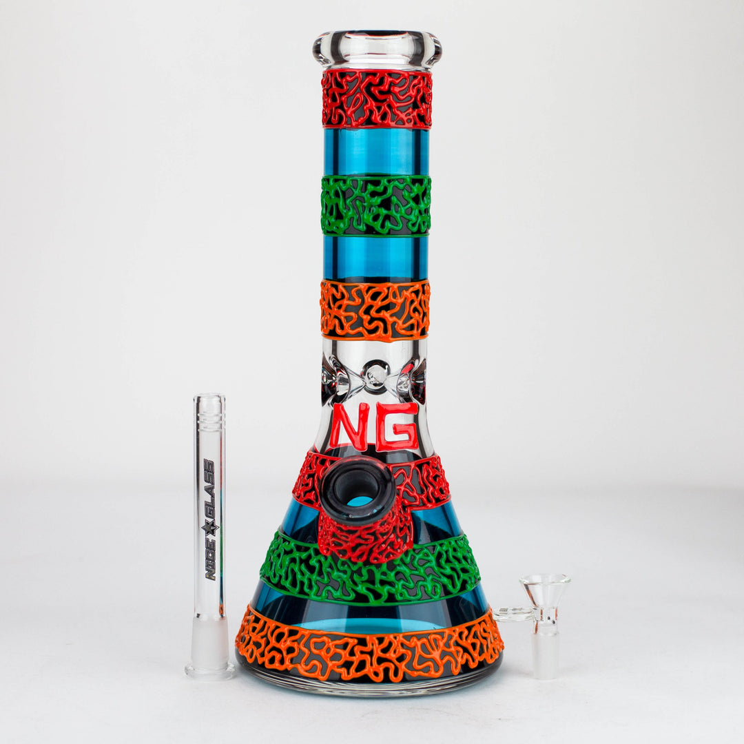 Full view of a vibrant blue beaker bong with red, green, and orange glow-in-the-dark patterns, displayed with its clear downstem and bowl.