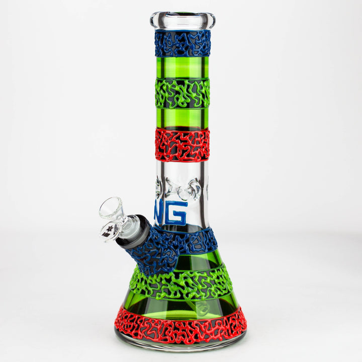 Full product shot of a 13-inch beaker bong with vibrant green, red, and blue textured silicone sleeves and 'NG' lettering on the clear glass body.